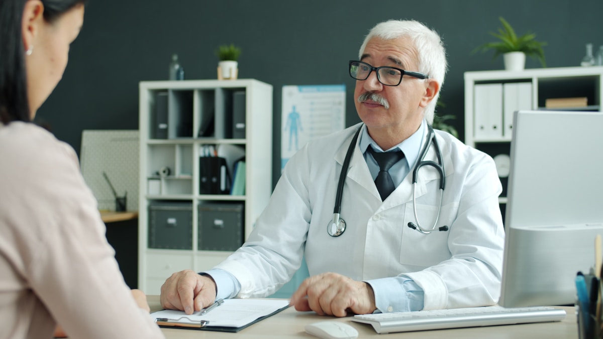 Doctor discussing an individualized IVF care plan with a patient